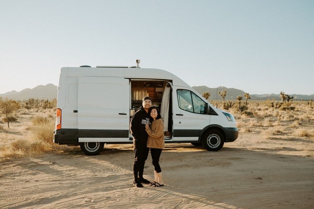 @gocamp_rentals Lovely couple camping in Joshua Tree National Park with a white camper from GoCamp campervan rentals