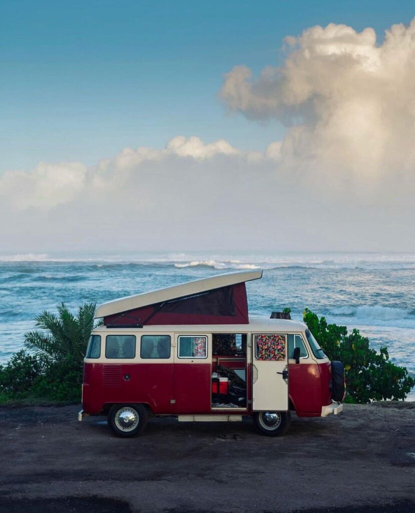@hisurfcampers rent a campervan for a road trip, red and white VW campervan at the beach