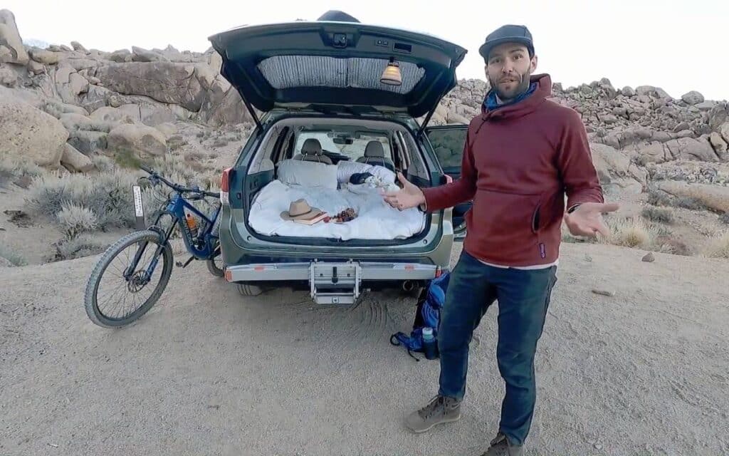 @outdoorgoyo Greg standing at the back of his SUV camper, subaru forester camper conversion