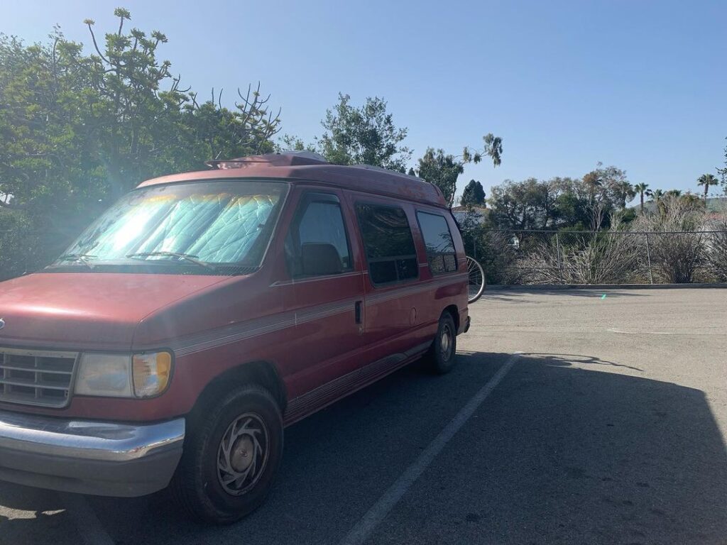 @roadquill van lifers stealth camping in a parking lot in the city