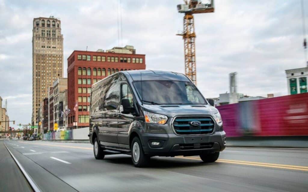 Black Ford e Transit van running on the road