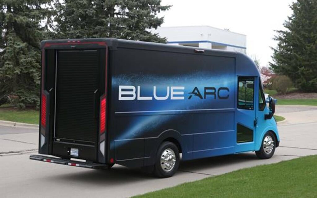 Blue Arc electric delivery van parked on the side of the road