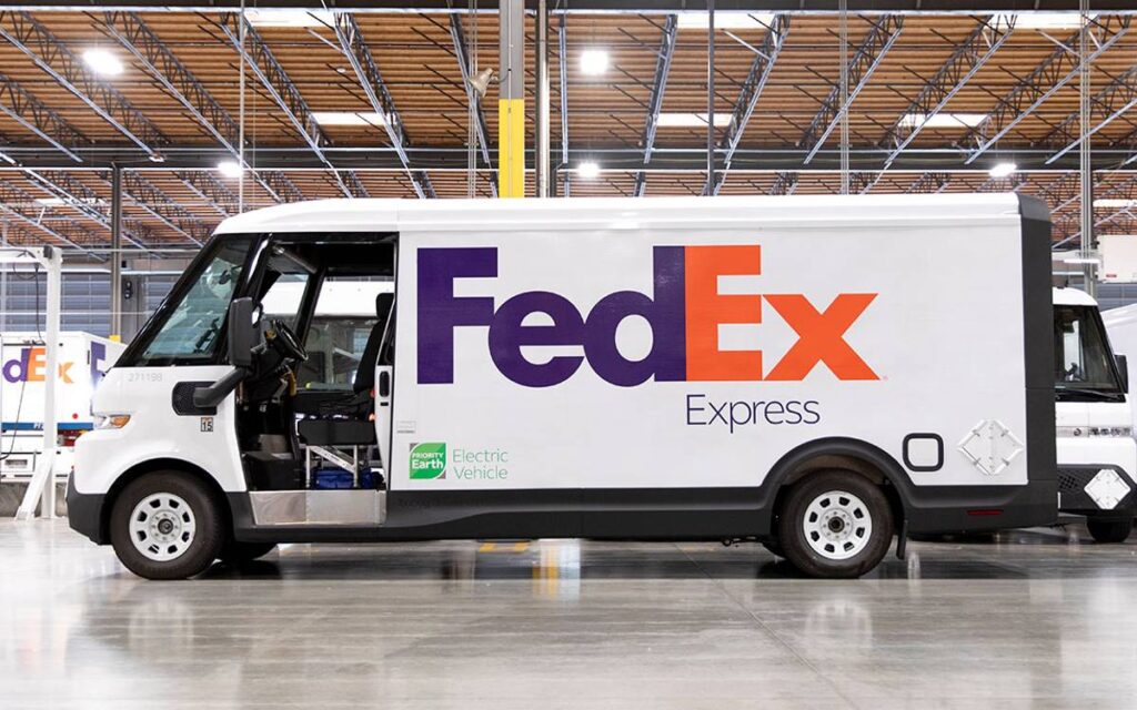 Side view of BrightDrop Zevo 600 white electric van with FedEx logo