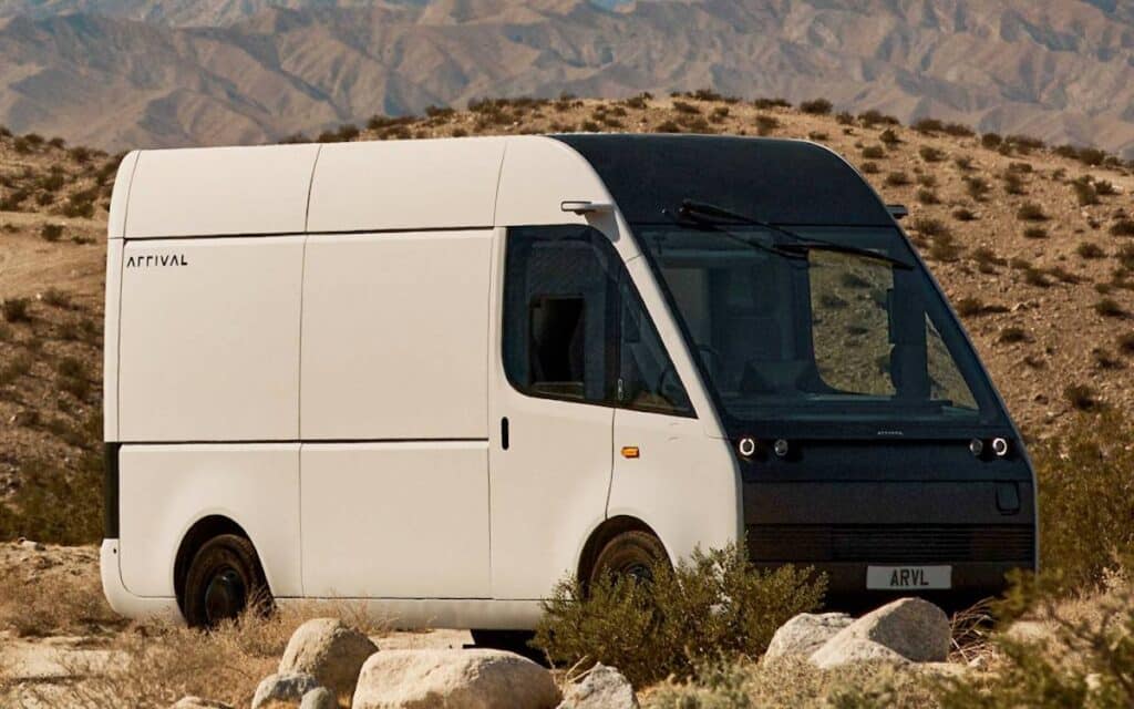 White Arrival van parked in the desert