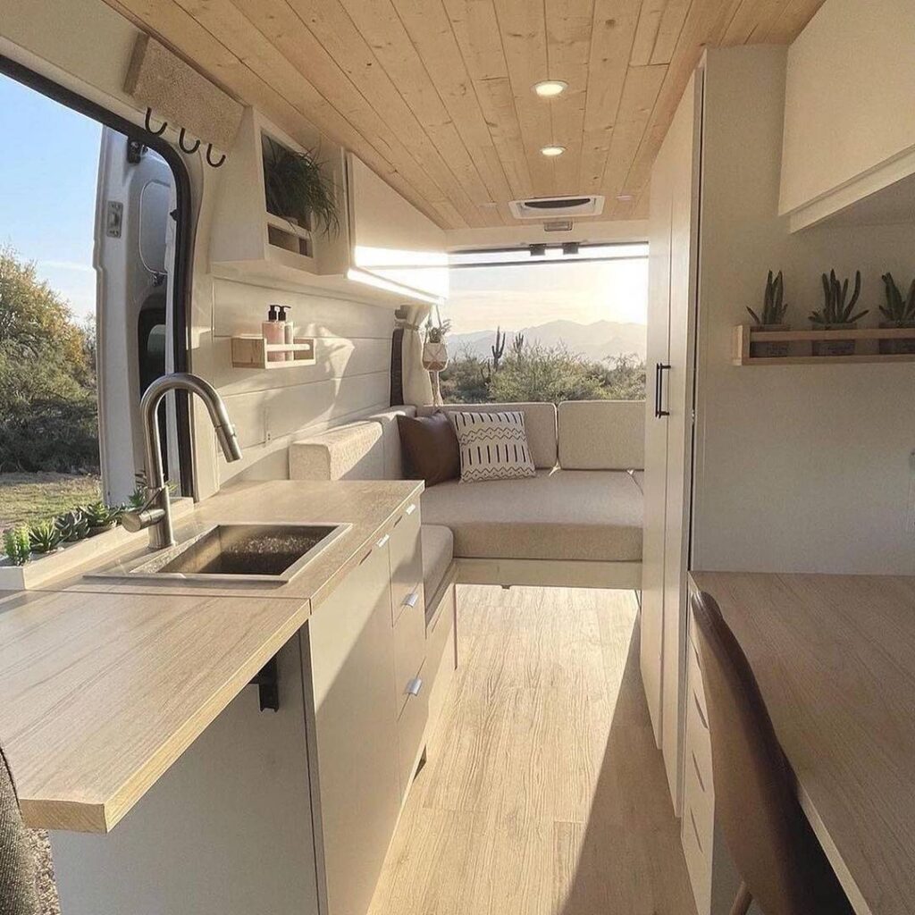@buyorsellcampers Modern camper van kitchen with storage cabinets 
