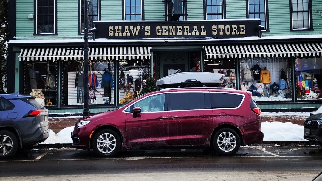 @chrysler.pacifica.adventures Maroon minivan parked in front of a store