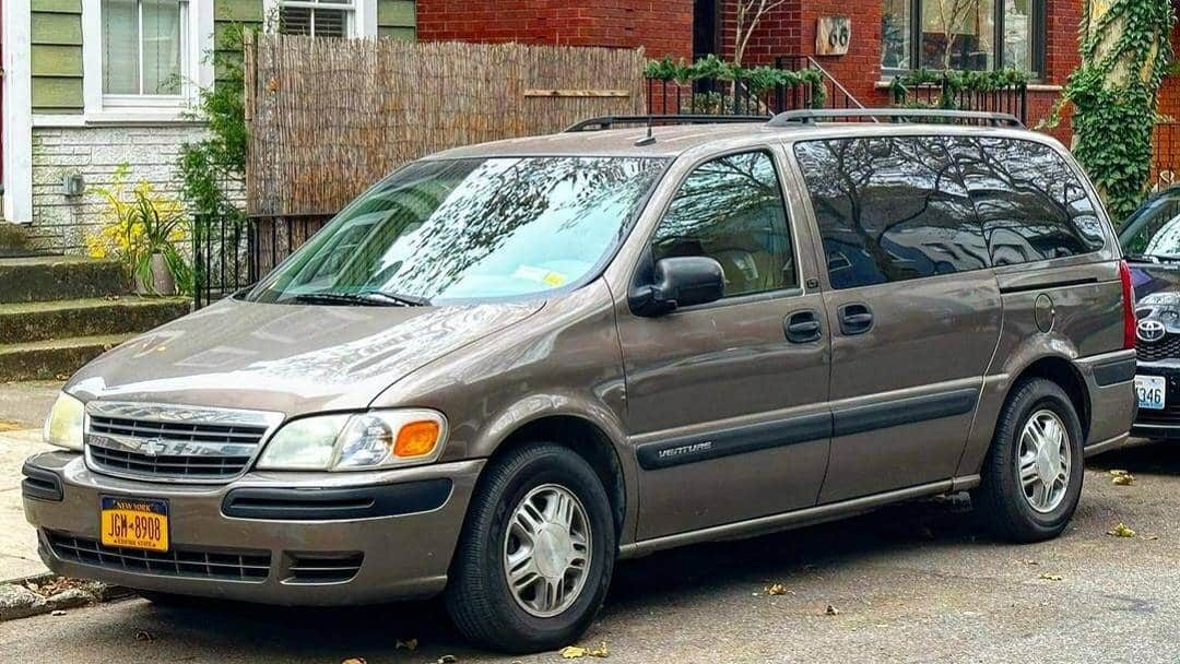 @parkedonthesidestreets Minivan parked on the side of the street