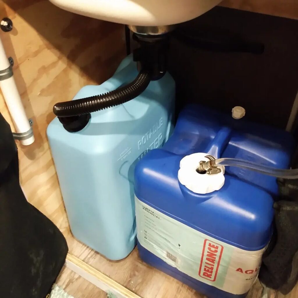 @von.moose Campervan water system, two water containers inside a van