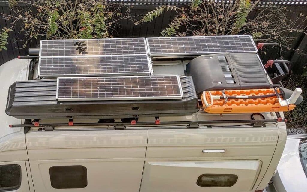 rv solar panel layout on camper van roof with storage box and roof ac