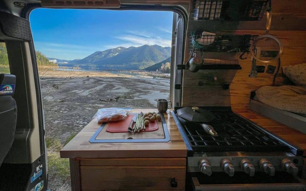 @art2d2n Van kitchen with view of mountain and lake