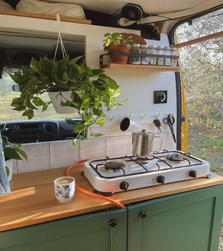 @beanie.van Coffee pot on stove inside camper van kitchen