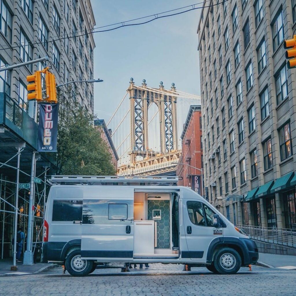 @brooklyncampervans White camper in the middle of a street in the city