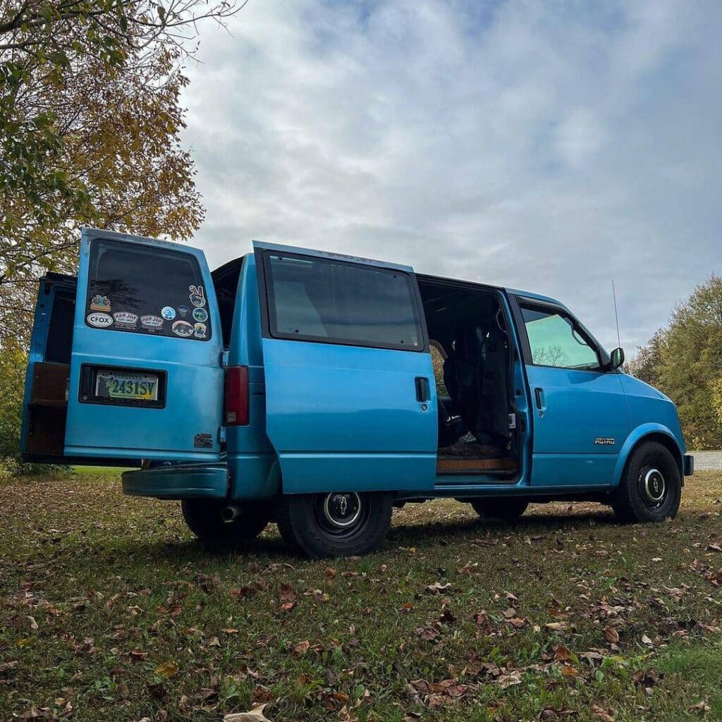 @the_ethnic_explorer Blue Chevy astro van parked on the side of the road