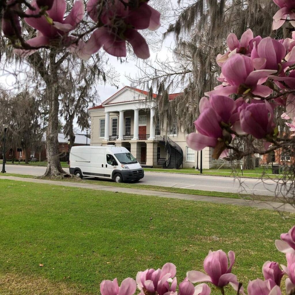 @wandacanwander White camper parked in a residential area