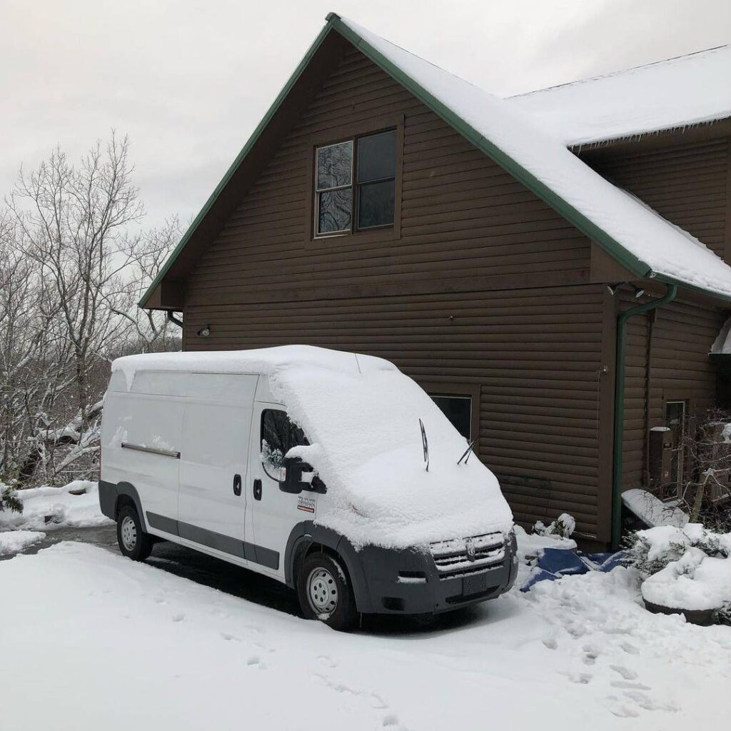 @wandacanwander White campervan covered in snow