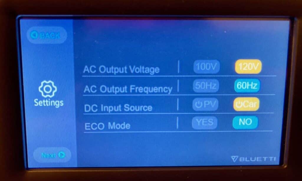 Close up of the display on the Bluetti AC200P showing the input and output settings