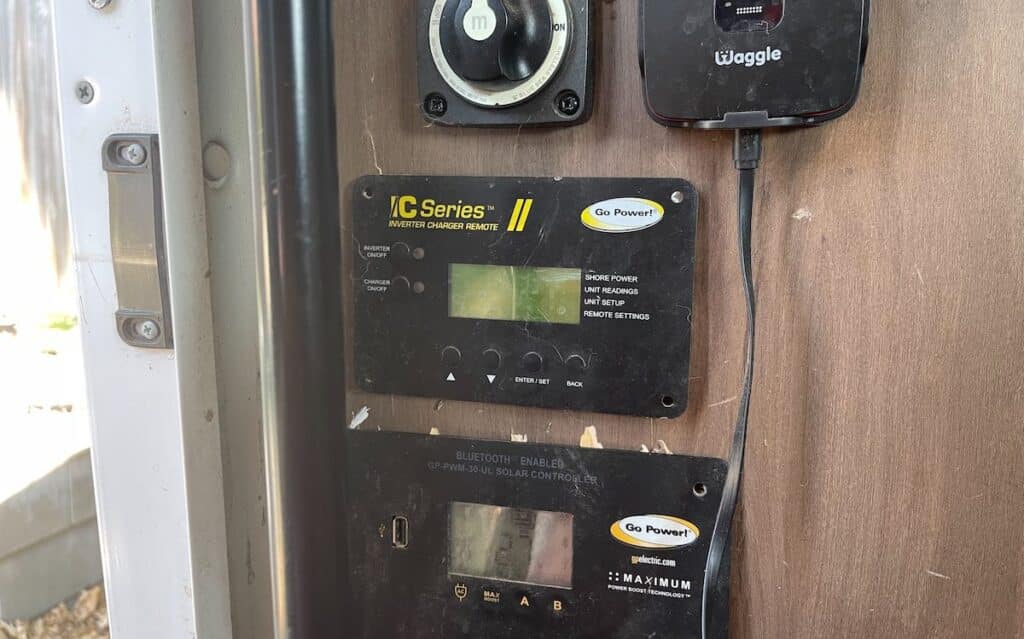 the electrical control panel in an rv, including charge controller, inverter remote, and cut off switch