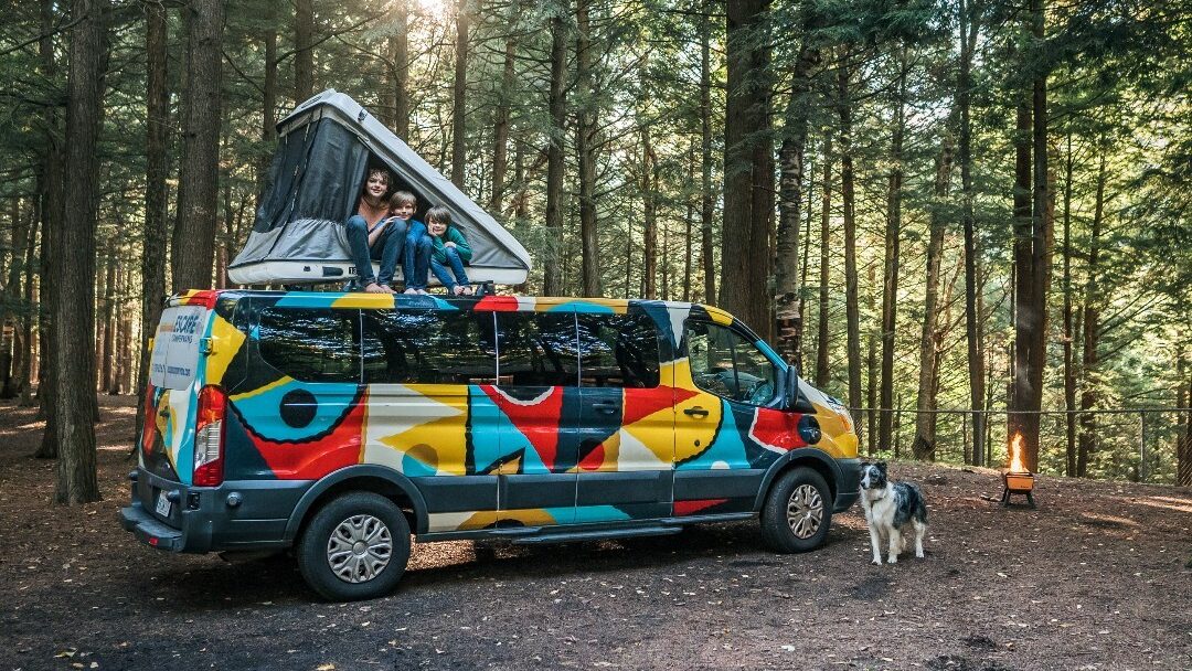 @escapecampervans A happy family van camping in the forest with Escape Campervans campervan rentals