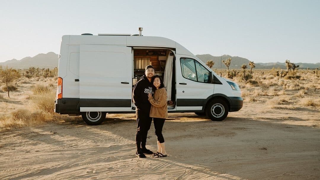 @gocamp_rentals Lovely couple camping in Joshua Tree National Park with a white camper van from GoCamp campervan rentals